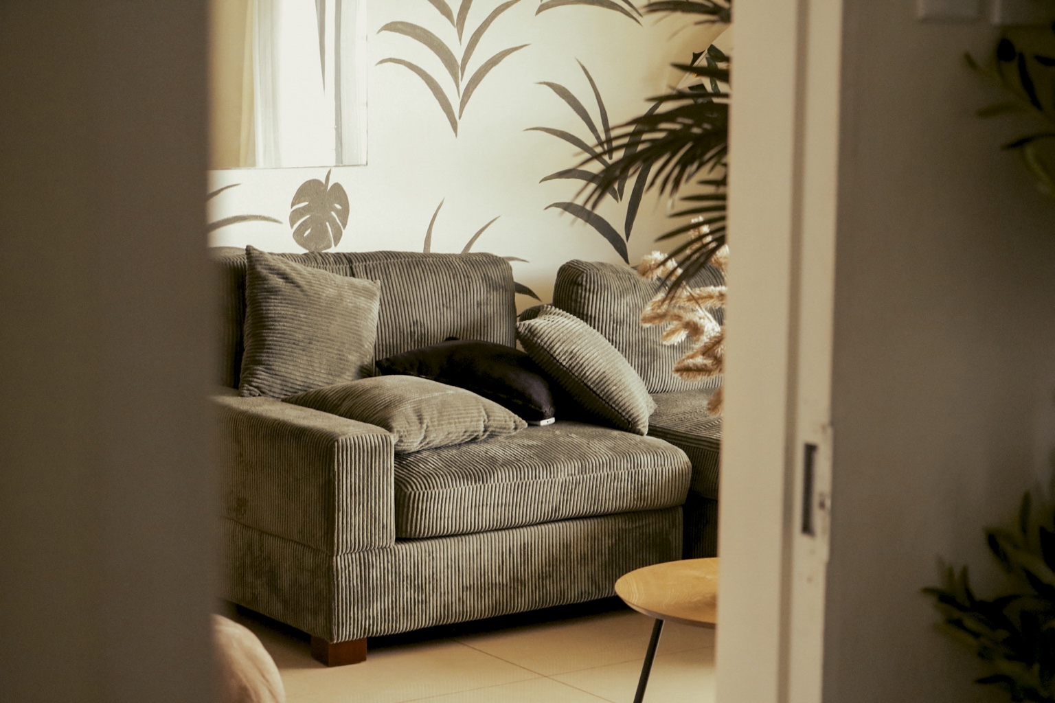 A couch seen through a doorway