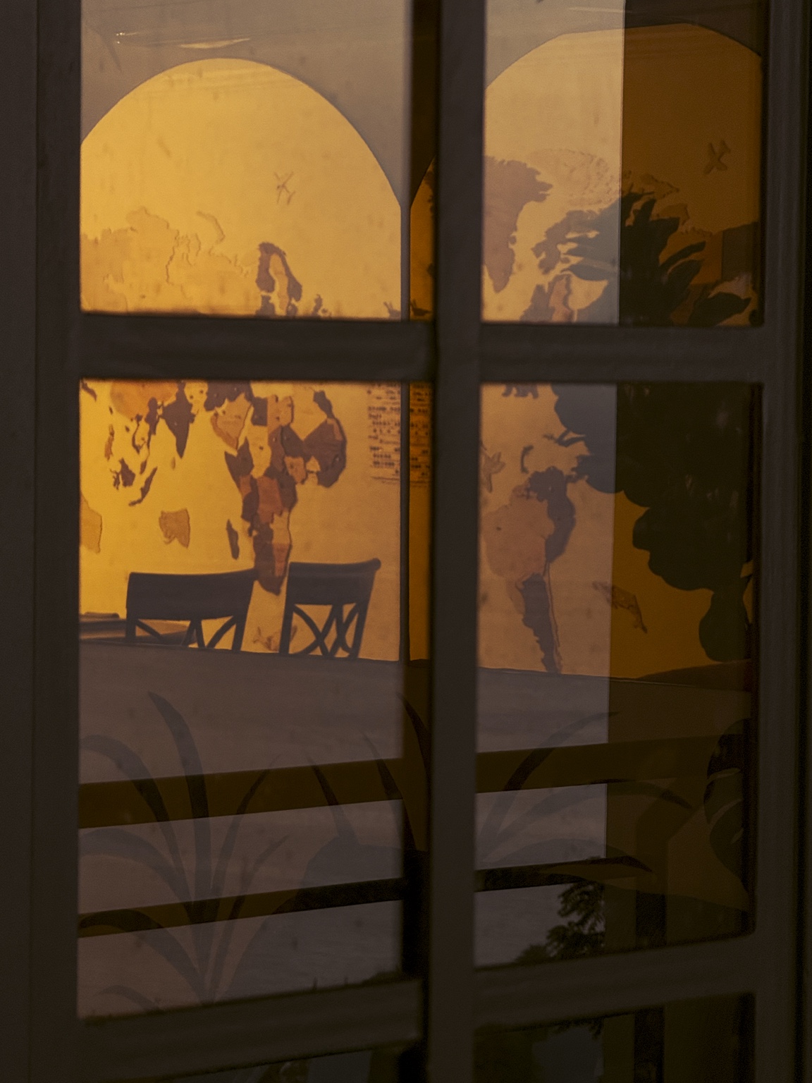 Dining room seen through a reflective window